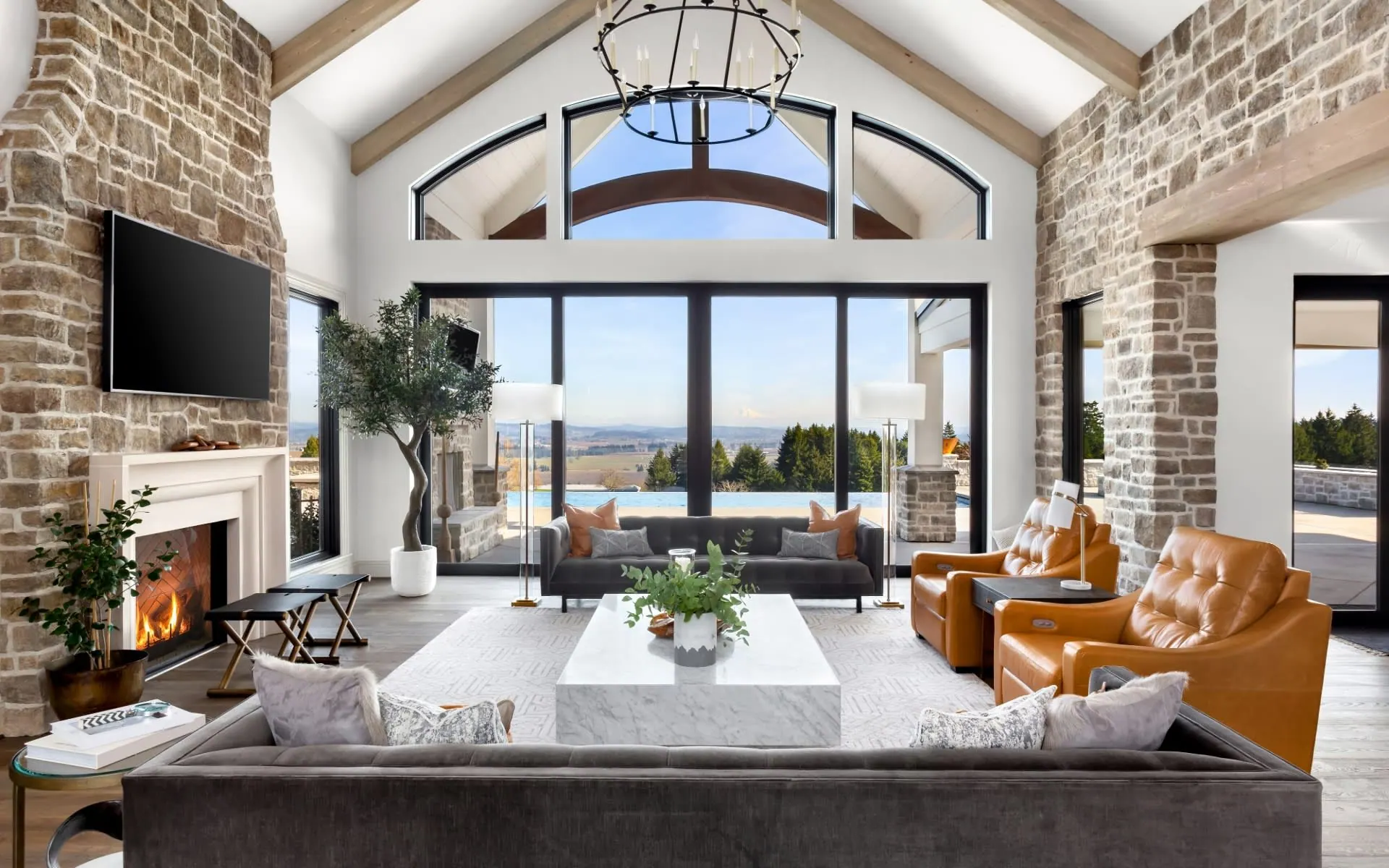 Great room with stone fireplace and vaulted ceiling